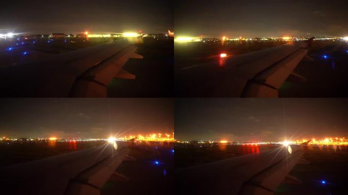 飞机乘客窗，带飞机机翼起飞，夜间照明灯