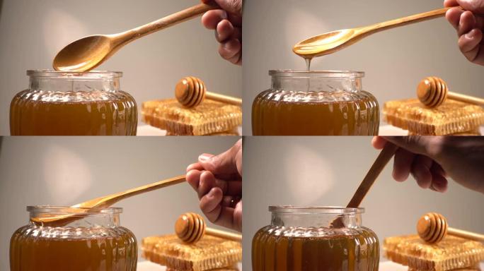 用木勺蜂蜜和蜂蜜梳子