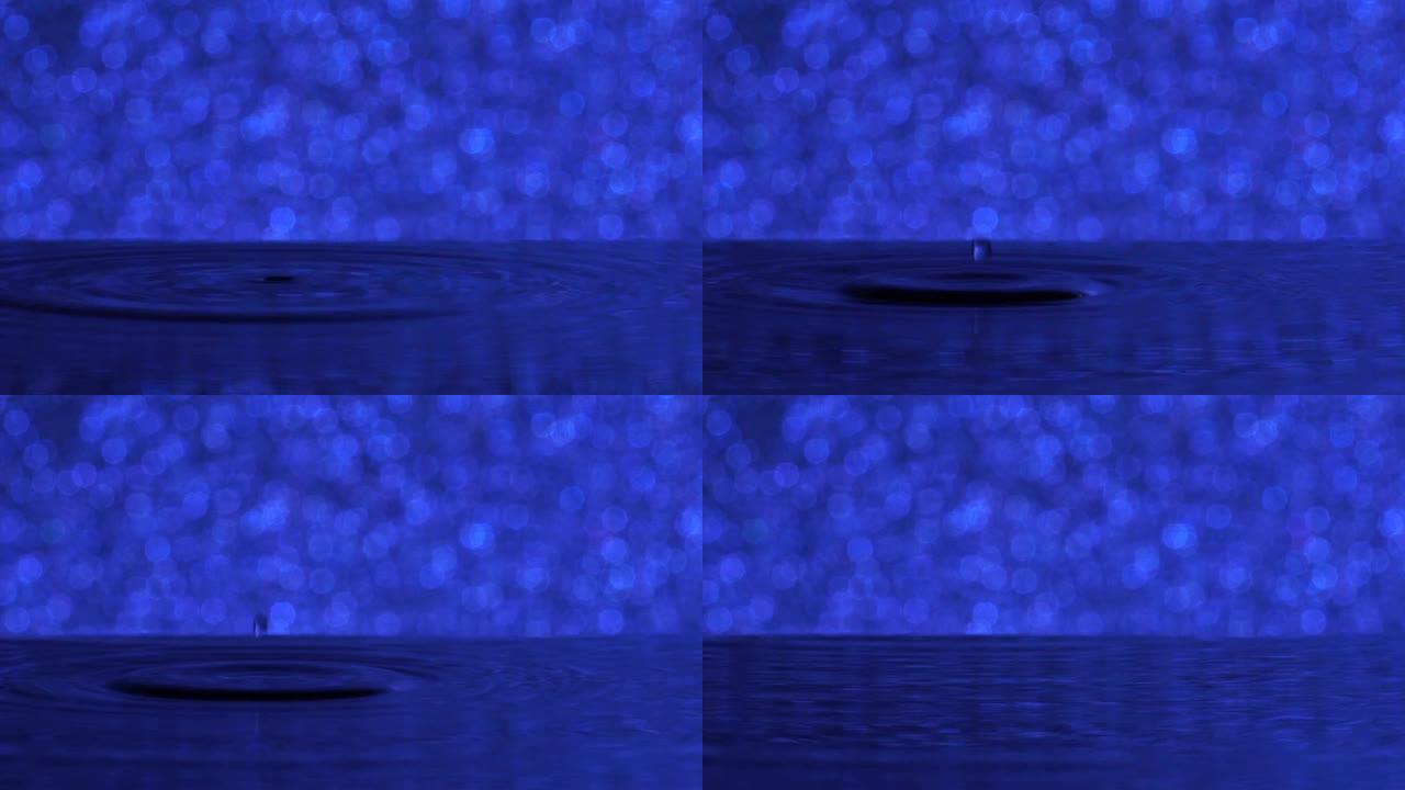 慢动作: 许多水滴变成蓝色的水。