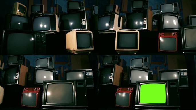 复古电视在许多电视中间打开绿色屏幕。蓝色钢调。