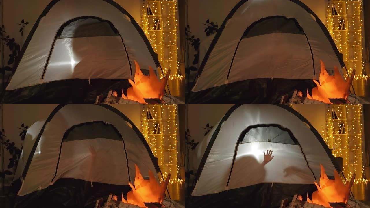 儿童剪影在帐篷中移动