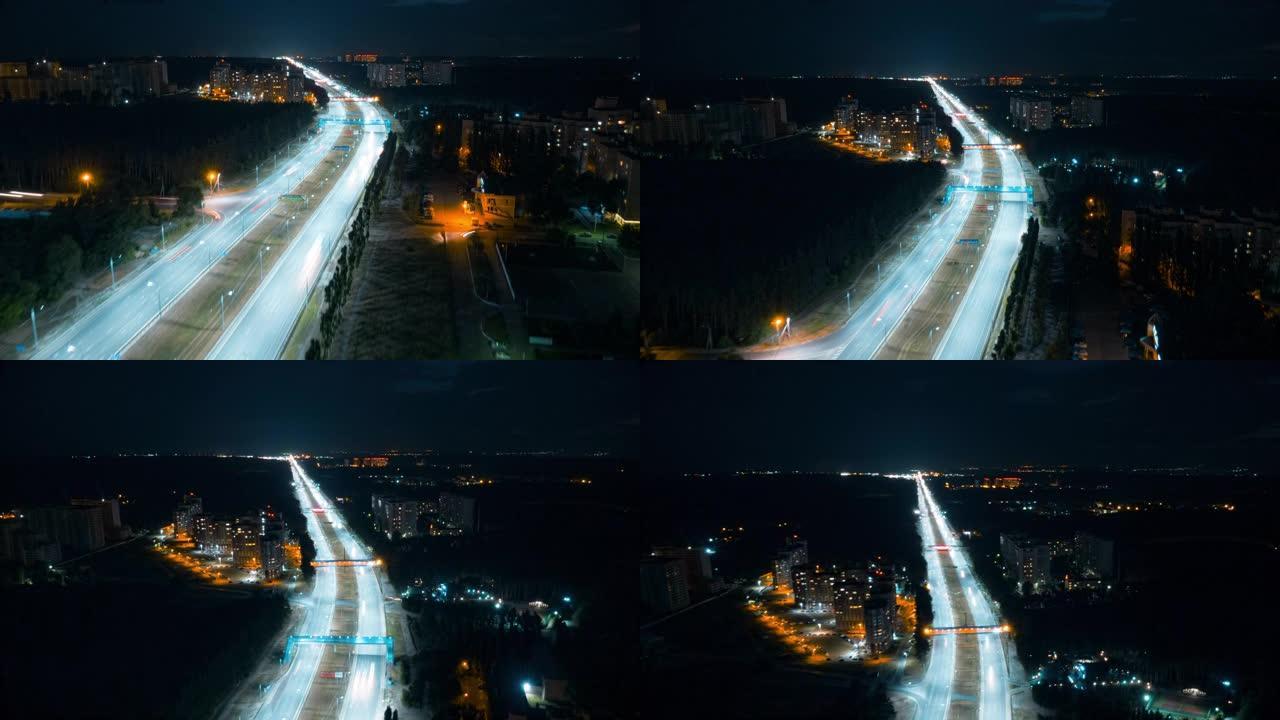 夜间城市交通快车在高速公路上行驶。4k鸟瞰图
