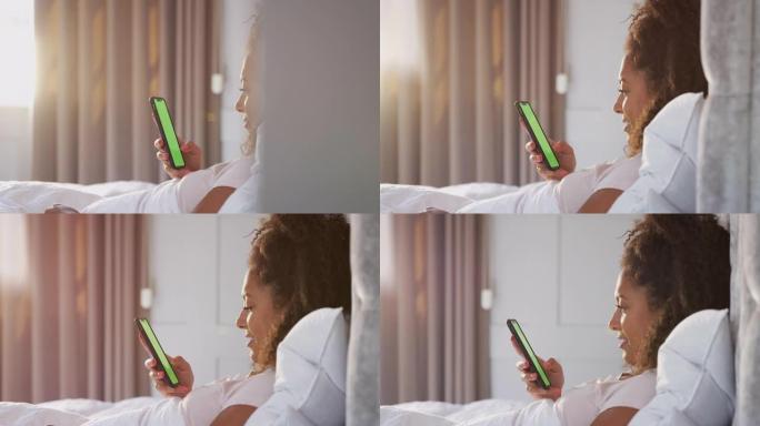 醒来后坐在床上看手机的女人