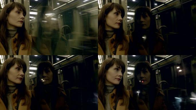 年轻冷静体贴美丽的高加索乘客女子的肖像从地铁车窗慢动作中向外看。