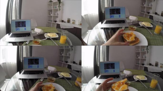 女人在家吃早餐看笔记本电脑系列的视点