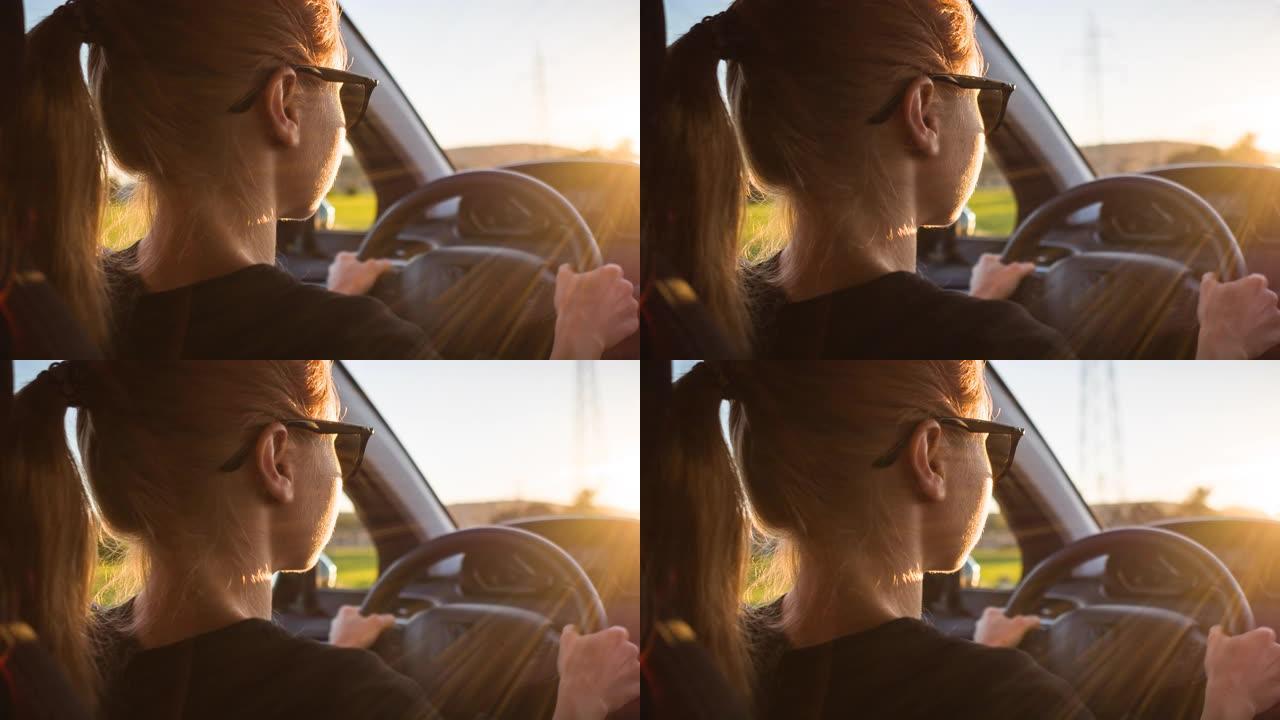 女人开车进入日落女人开车进入日落司机