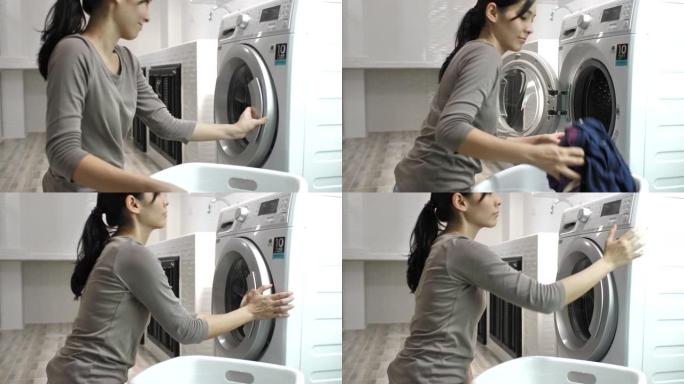 美女在自动洗衣房洗衣服