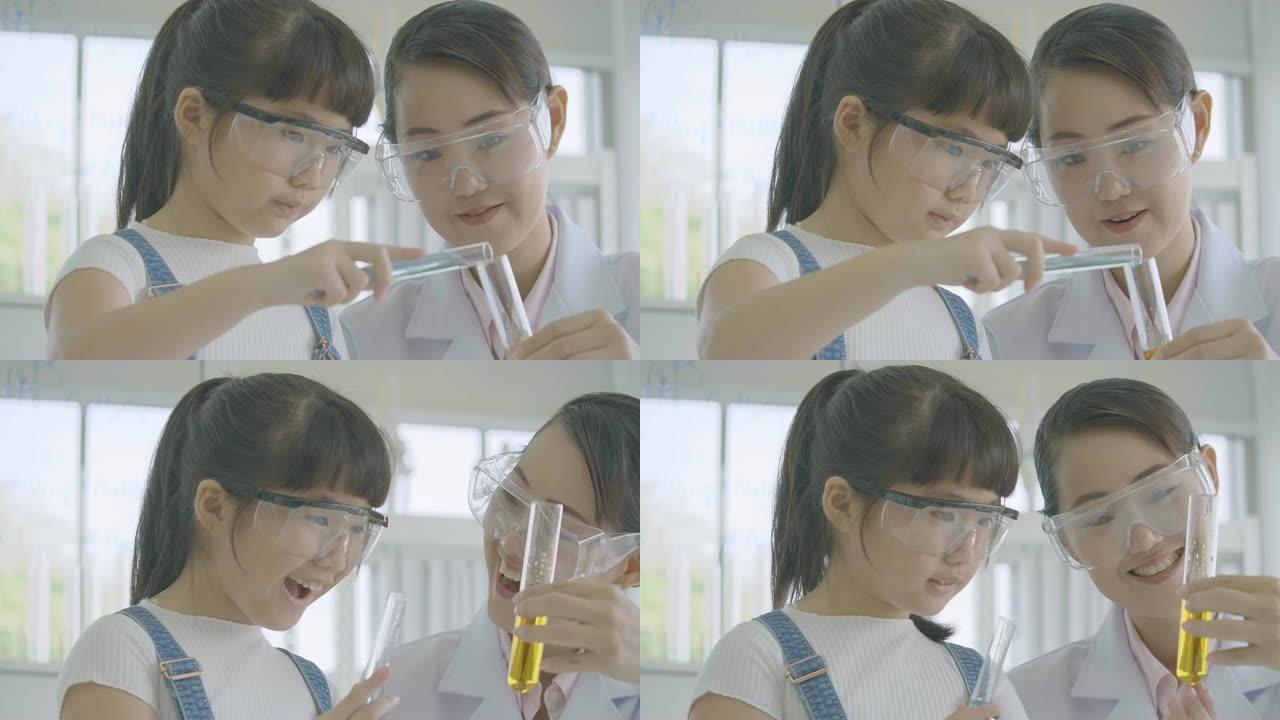 小亚洲学生女孩在科学实验实验班学习。科学与教育。