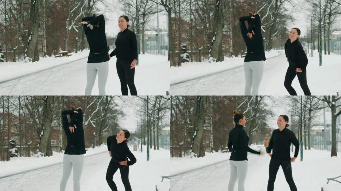 两个女人在雪地里锻炼