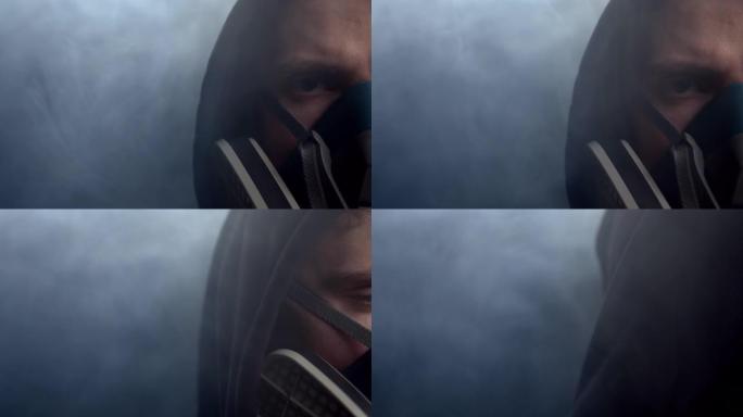 在他周围的烟雾中，防护面罩中的一部分人的脸。