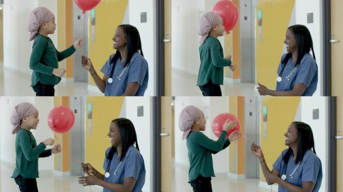 黑人女护士为儿童癌症患者提供气球