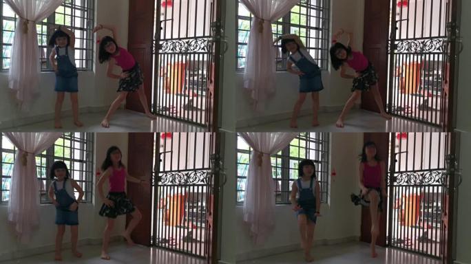 2亚裔华裔少女在客厅热身运动