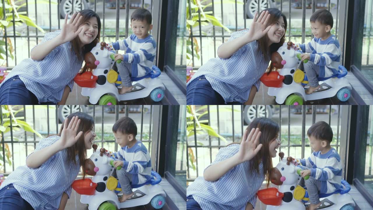4k慢动作镜头亚洲小男孩和姐姐一起玩玩具车充满幸福在现代房子的前草坪上进行自我学习或家庭学校，家庭和