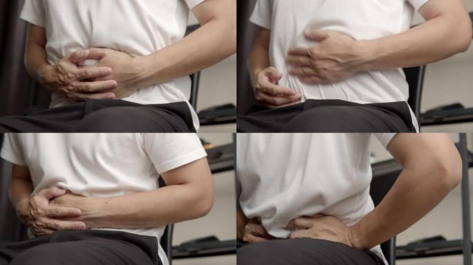 亚洲男子胃痛疼痛难受手按肚子痉挛