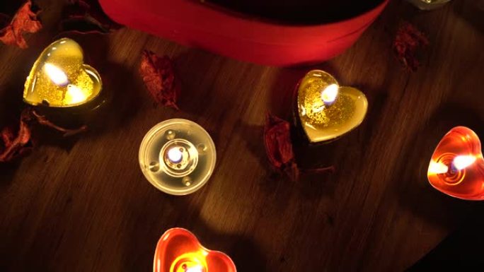 4k情人节浪漫，红心，蜡烛和玫瑰花瓣。