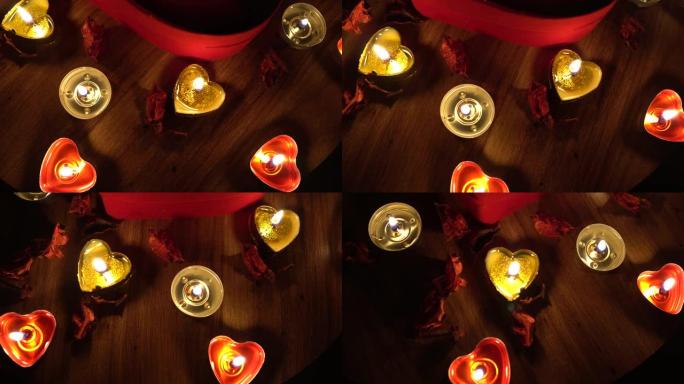4k情人节浪漫，红心，蜡烛和玫瑰花瓣。