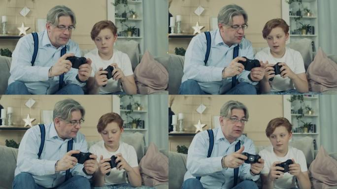 老人正在与孙子一起观察游戏机