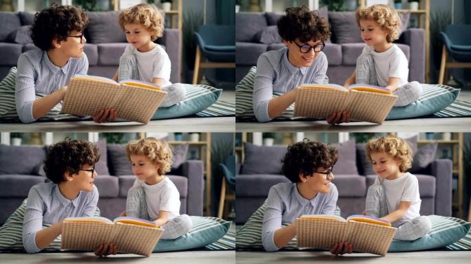 快乐的小男孩和他的妈妈在公寓里看书和在毯子上聊天