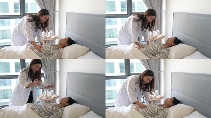 亚洲华裔女性患者躺在床上，女医生正在用听诊器检查她的心跳
