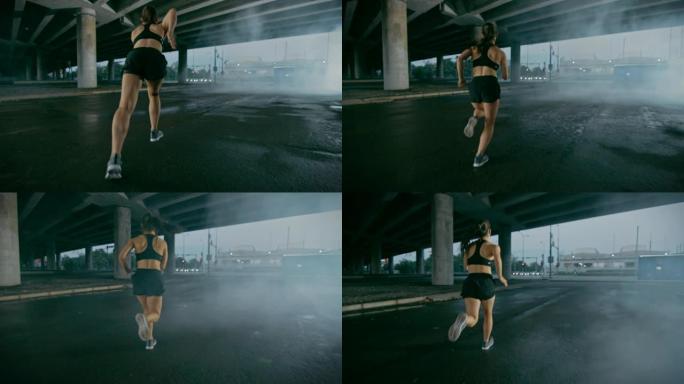 穿着黑色运动上衣和短裤的美丽强壮健身女孩开始冲刺。她在城市环境中奔跑，背景是汽车。