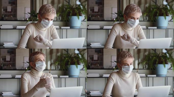 女商人戴着医用口罩和手套在家庭办公室工作
