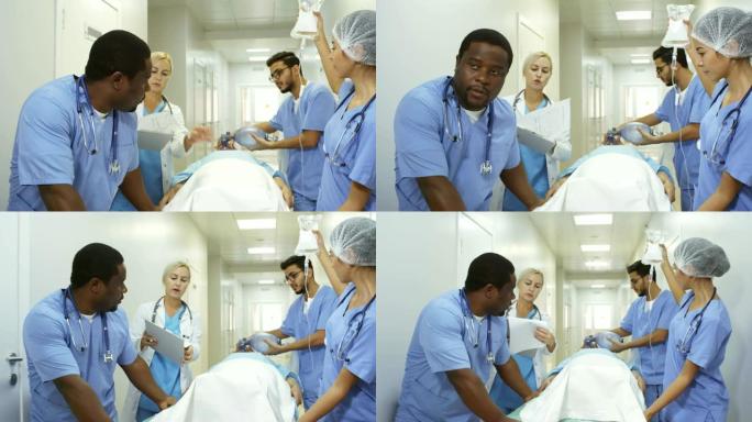 医生与急诊室护士交谈，用病人推着轮床