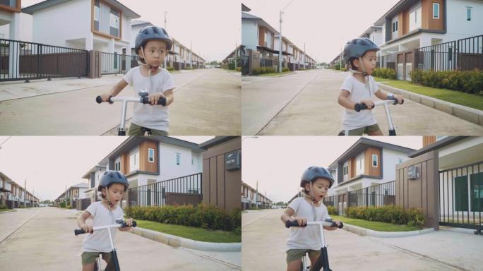 幼儿骑平衡自行车。