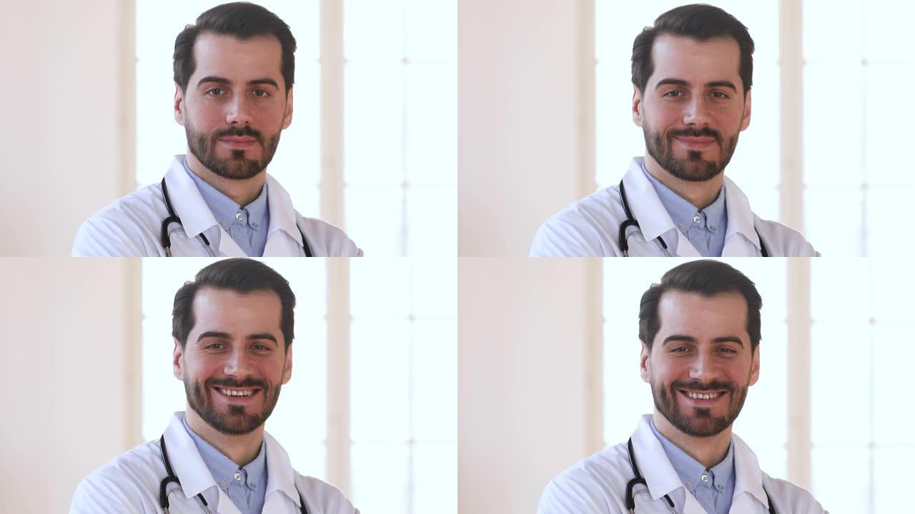 微笑自信的男医生穿着白色制服看着相机