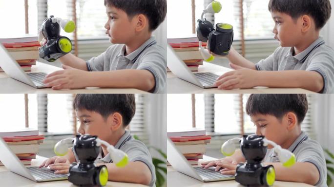 Boy在家中计算机上进行构建和编程，并将其作为学校科学项目来构建机器人。他对自己的工作非常满意。教育