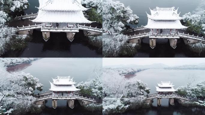 杭州西湖景观古建筑白雪覆盖湖面