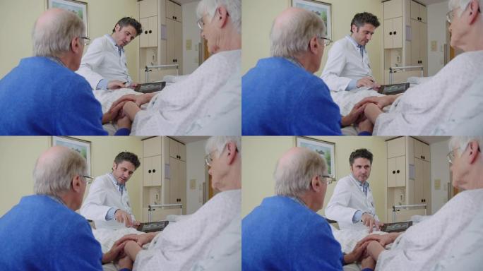 骨科医生在医院病房检查一名高级妇女的膝盖