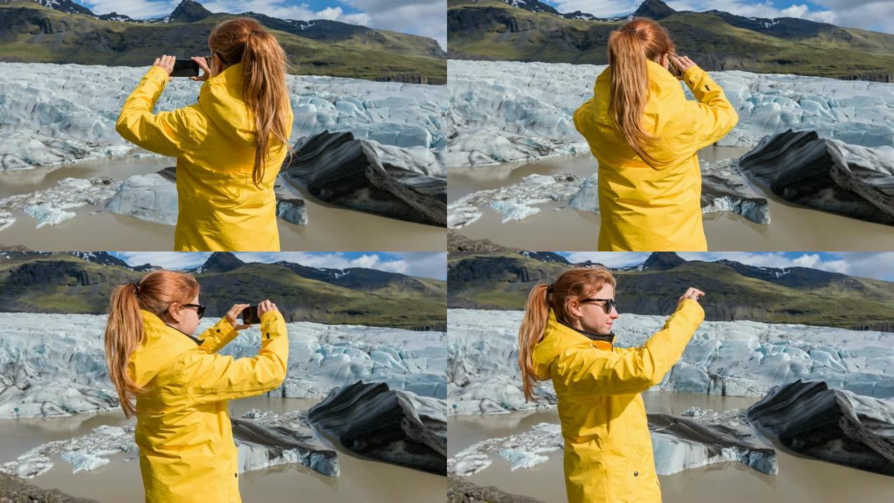 为冰岛的Svinafellsjokull冰川拍摄全景照片的女人