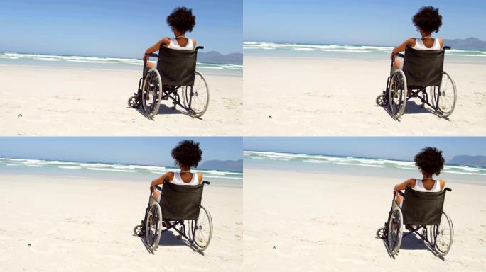 坐在4k海滩轮椅上的残疾妇女