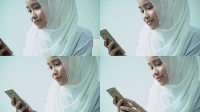 穆斯林女商人使用电话的肖像