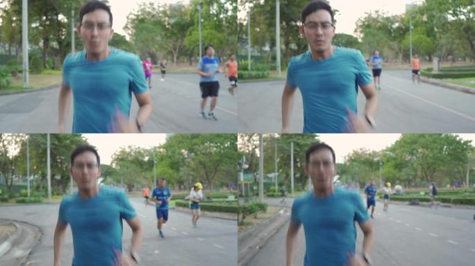 亚洲人在公园里跑得很快，超过了人们