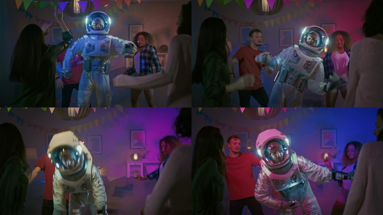 在大学服装派对上: 穿着太空服的有趣家伙跳舞，做机器人舞蹈现代动作。和他一起美丽的女孩和男孩在霓虹灯