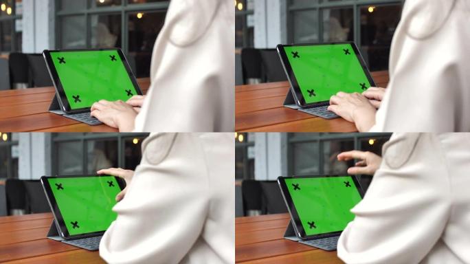 女性打字绿屏数字平板电脑