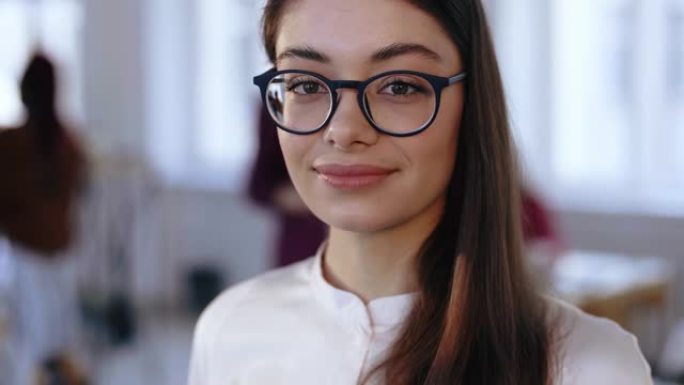 Close-up portrait, happy young brunette design pro