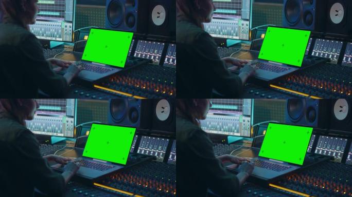 女艺术家，音乐家，制作人，音频工程师在音乐唱片公司的新专辑中工作，使用绿屏笔记本电脑，控制台进行混音
