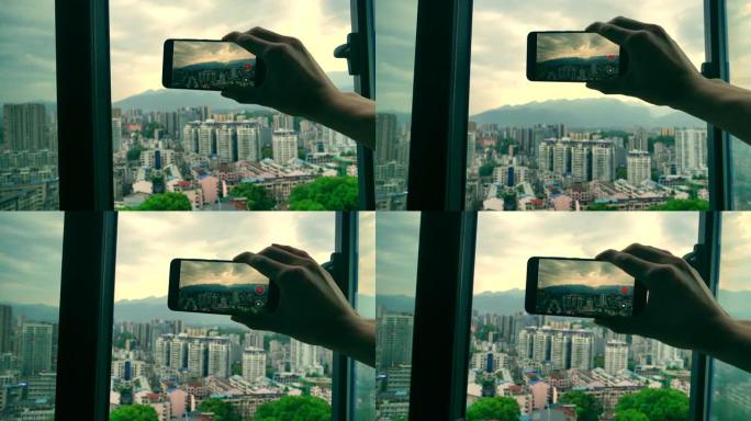 通过窗口通过电话记录城市风景