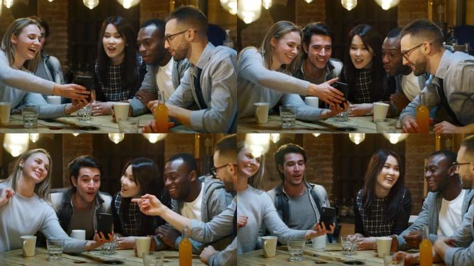 微笑的朋友在咖啡馆喝咖啡，玩手机的慢动作。