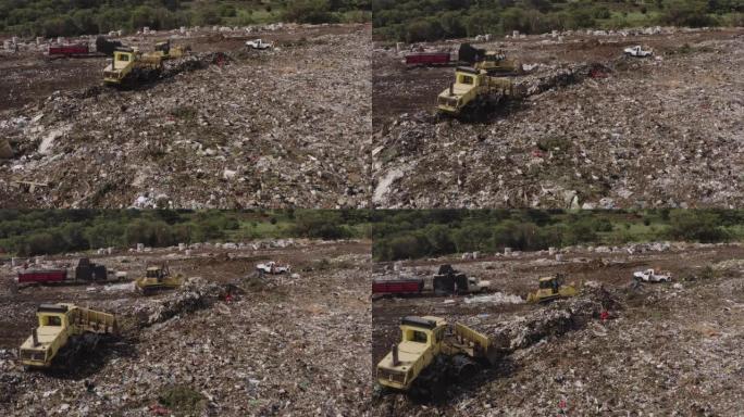 4k空中放大推土机和在垃圾填埋场工作的人，有数百只欧洲白鹳在清理或食物
