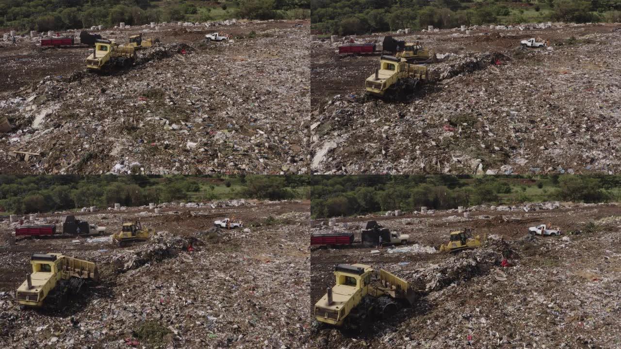 4k空中放大推土机和在垃圾填埋场工作的人，有数百只欧洲白鹳在清理或食物