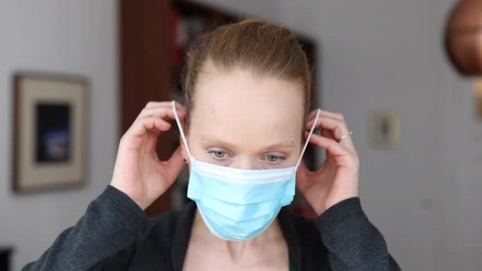妇女戴上医用口罩以防止新型冠状病毒肺炎