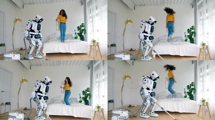 当机器人清理地板时，快乐的女孩跳到床上。机器人、半机械人与人类概念。