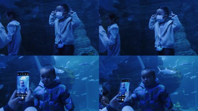 宝妈给孩子拍照记录生活海洋馆海洋世界