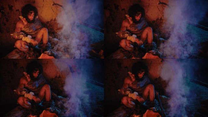 原始穴居人的肖像穿着动物皮坐在他的山洞里，在火附近变暖。原始尼安德特人猎人/智人晚上独自在他的巢穴