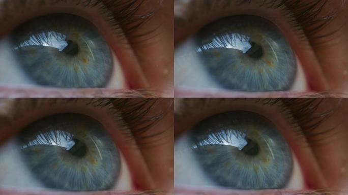 男性蓝眼睛的慢动作微距特写镜头在镜头外注视和眨眼