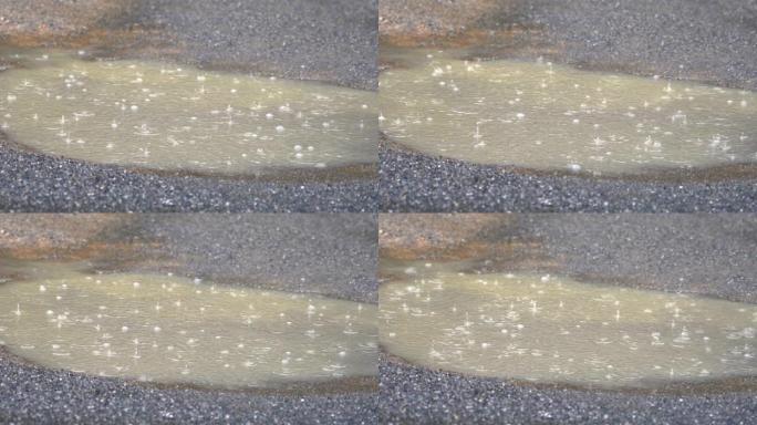 4k雨滴落在乡村街道的泥土上