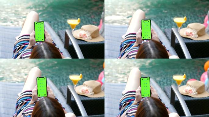 年轻女子在游泳池上放松手机，色度键-垂直